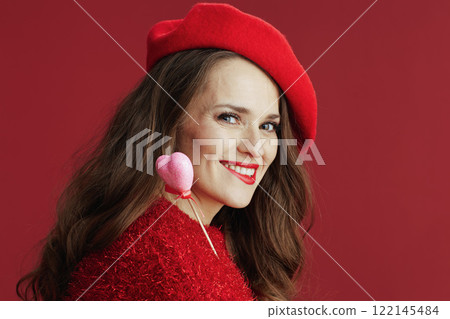 smiling stylish woman in red sweater and beret 122145484