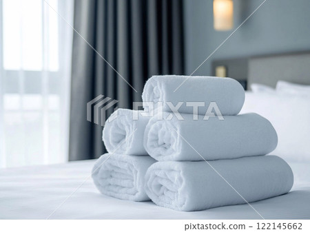 Stack of new white bath towels on bed in hotel room waiting for new guests.Macro.AI Generative. 122145662