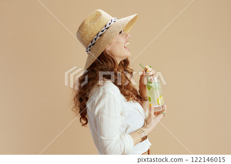 happy trendy housewife in blouse and shorts on beige happy trendy housewife in blouse and shorts on beige 122146015