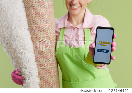Happy woman showing smartphone screen 122146403