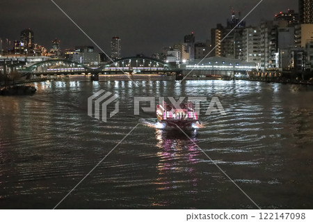 Illuminated Boat on Calm Night Water Reflecting City Lights, japan Dec 4 2024 122147098