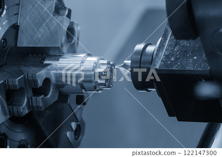 The CNC lathe machine chamfer cut the metal shaft parts by milling spindle. 122147300