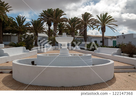 White fountain and benches, Teguise, Lanzarote, Spain 122147368
