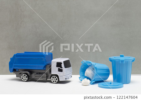Image of a plastic garbage bucket and a garbage truck Image of a plastic garbage bucket and a garbage truck 122147604
