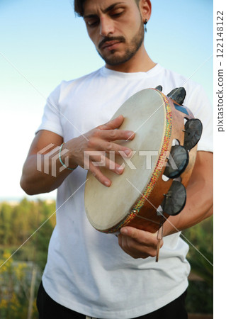 Joyful Tambourine Beats in Rolling Countryside Joyful Tambourine Beats in Rolling Countryside 122148122