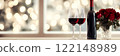 Valentines banner, bokeh background, bottle of red wine, wine glass, bouquet of red roses, empty space. Template for Valentine's Day menu advertisements, anniversaries, celebrations, mock up. 122148989