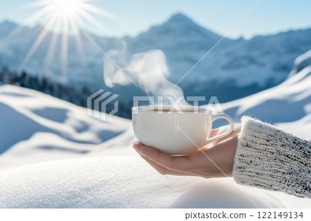 Hand Holding Tea Cup Against Snow-Covered Mountains. Sunlight Highlighting Steam Rising From Hot Drink. Tranquil And Refreshing Winter Scene. AI generated 122149134
