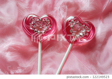lollipop with heart shaped on pink background 122149523