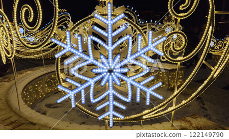 Beautiful glowing Christmas and New year decorations with big abstract snowflakes Beautiful glowing Christmas and New year decorations with big abstract snowflakes 122149790