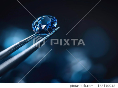 Macro shot of a blue sapphire diamond stone held by tweezers on dark blue background.AI Generative. 122150038