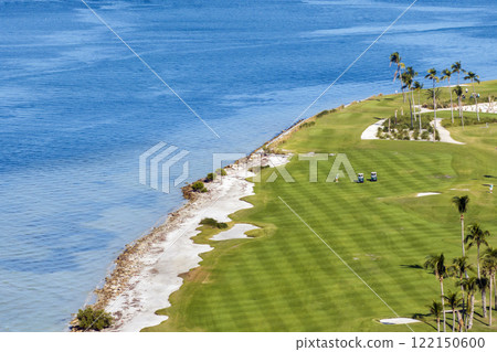 Big golf course field with green grass in Boca Grande, small town on Gasparilla Island in southwest Florida Big golf course field with green grass in Boca Grande, small town on Gasparilla Island in southwest Florida 122150600