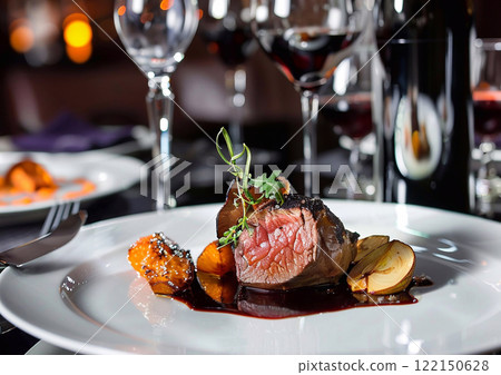 Juicy beef steak on white porcelain plate with wine glasses in luxury restaurant.AI Generative. 122150628