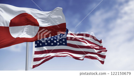 Flags of Greenland and the US waving in the wind on a clear day Flags of Greenland and the US waving in the wind on a clear day 122150679