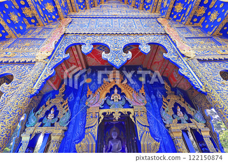 A beautiful view of the front entrance of the Blue Temple, Wat Rong Suea Ten A beautiful view of the front entrance of the Blue Temple, Wat Rong Suea Ten 122150874