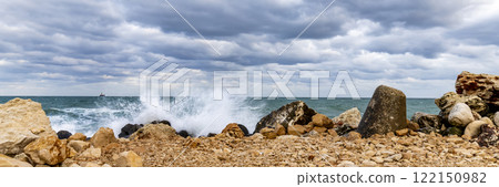 Wave splash at rocky shore  122150982