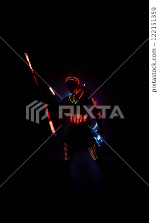 Led dancer performing in the dark with light emitting suit and gloves Led dancer performing in the dark with light emitting suit and gloves 122151359