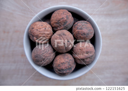 Flat Lay of Desi Walnuts in a White Bowl - Rustic Natural Food Flat Lay of Desi Walnuts in a White Bowl - Rustic Natural Food 122151625