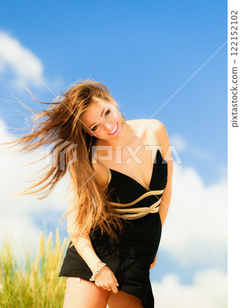 Happy smiling woman outdoor 122152102