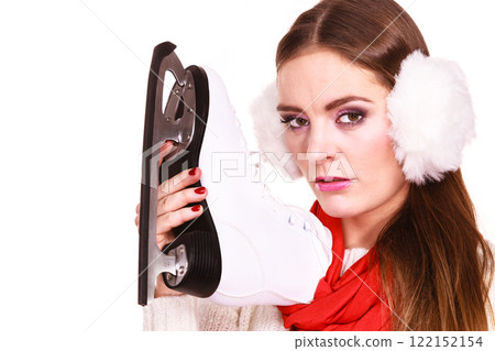Pensive woman with ice skates Pensive woman with ice skates 122152154