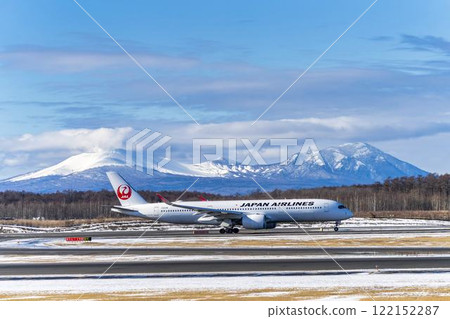 Planes at New Chitose Airport in winter, Mount Tarumae and Mount Fusubushi, Chitose, Hokkaido 122152287