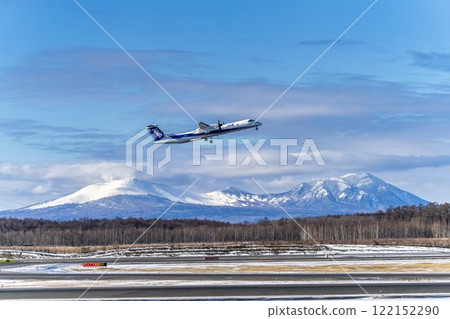 Planes at New Chitose Airport in winter, Mount Tarumae and Mount Fusubushi, Chitose, Hokkaido 122152290