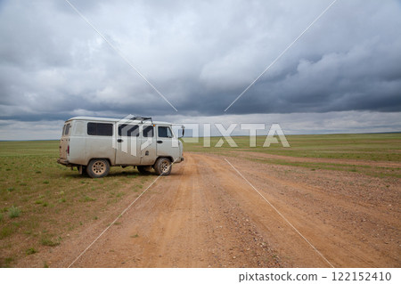 Off-road vehicles in remote region of Mongolia. Gobi desert area Off-road vehicles in remote region of Mongolia. Gobi desert area 122152410