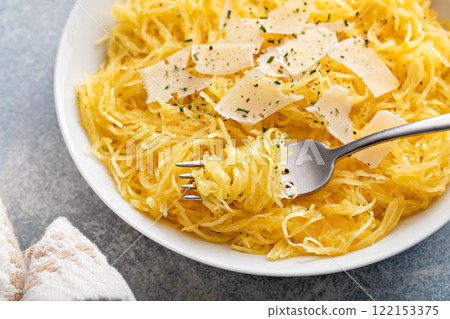 Spaghetti squash roasted and pulled apart served with olive oil and parmesan Spaghetti squash roasted and pulled apart served with olive oil and parmesan 122153375