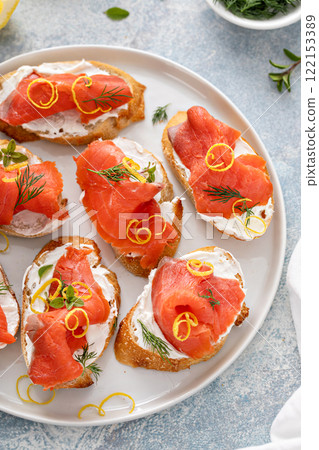 Smoked salmon crostini or bruschetta with cream cheese and lox Smoked salmon crostini or bruschetta with cream cheese and lox 122153389