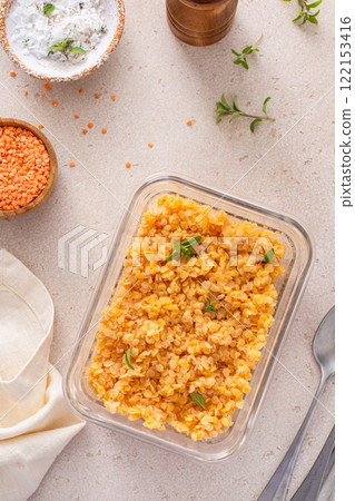 Cooked red lentils in a glass container, vegan protein source Cooked red lentils in a glass container, vegan protein source 122153416