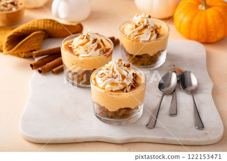 Pumpkin dessert in a cup, pudding or no bake cheesecake with spices and whipped cream 122153471