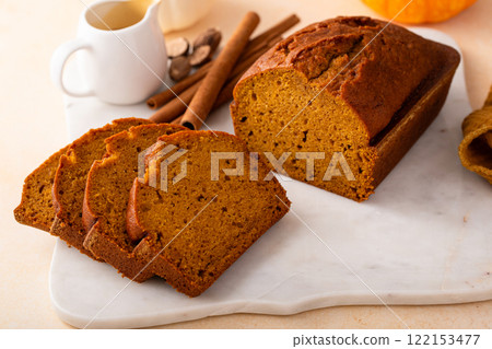 Pumpkin bread freshly baked sliced on a serving board, Thanksgiving dessert Pumpkin bread freshly baked sliced on a serving board, Thanksgiving dessert 122153477