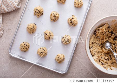 Scoops of cookie dough on baking sheet 122153497
