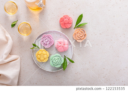 Traditional Chinese snow skin mooncakes for mid autumn festival with fruit, taro and matcha filling 122153535