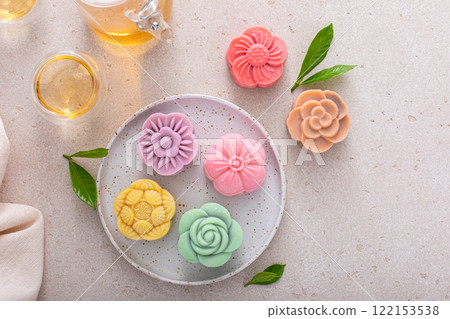 Traditional Chinese snow skin mooncakes for mid autumn festival with fruit, taro and matcha filling 122153538