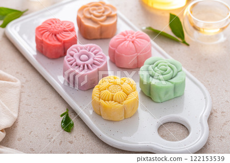 Traditional Chinese snow skin mooncakes for mid autumn festival with fruit, taro and matcha filling 122153539