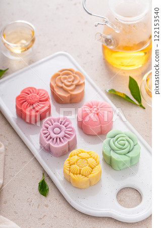 Traditional Chinese snow skin mooncakes for mid autumn festival with fruit, taro and matcha filling 122153540