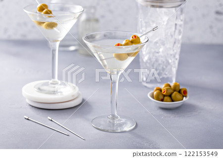 Martini cocktail with vodka, vermouth and olive garnish Martini cocktail with vodka, vermouth and olive garnish 122153549