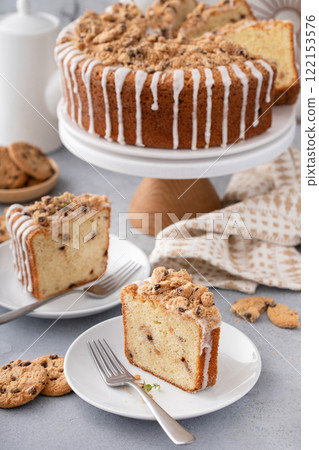 Delicious crumb cake with icing on plate 122153576