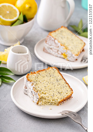 Lemon poppy seed cake on white plate 122153587
