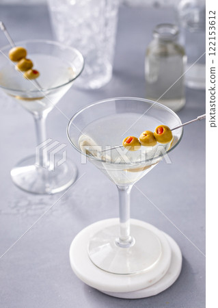 Martini cocktail with vodka, vermouth and olive garnish 122153612