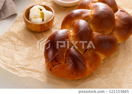 Homemade sliced challah bread with butter and honey 122153665