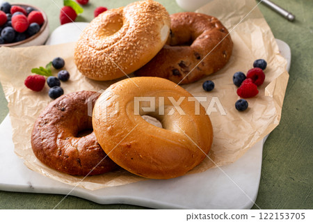 Freshly baked bagels ready to eat for breakfast, sesame, cinnamon and plain 122153705