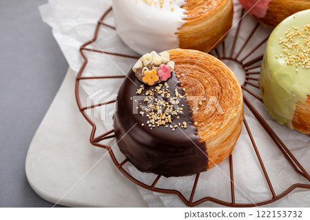 Round croissants with filling and glaze, trendy dessert 122153732