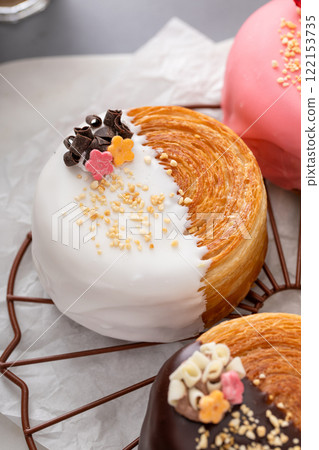 Round croissants with filling and glaze, trendy dessert 122153735