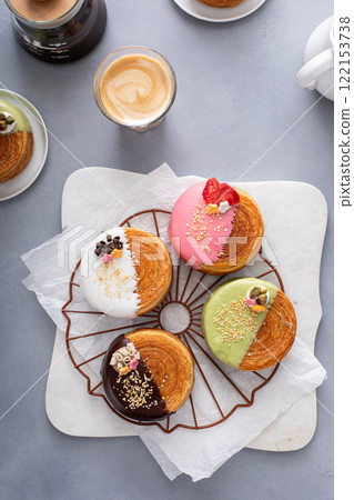 Round croissants with filling and glaze, trendy dessert 122153738