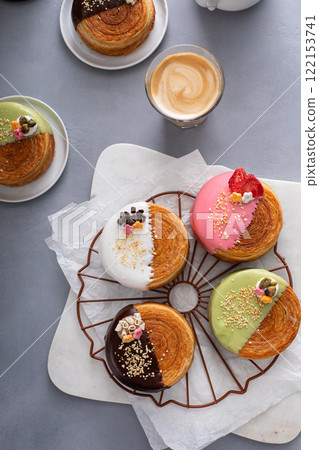 Round croissants with filling and glaze, trendy dessert 122153741