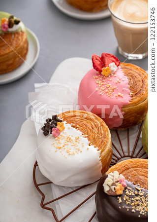 Round croissants with filling and glaze, trendy dessert Round croissants with filling and glaze, trendy dessert 122153746