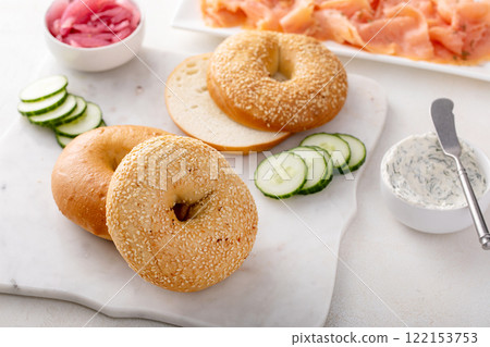 Plain bagels served with smoked salmon, fresh cucumber, red onion and cream cheese Plain bagels served with smoked salmon, fresh cucumber, red onion and cream cheese 122153753
