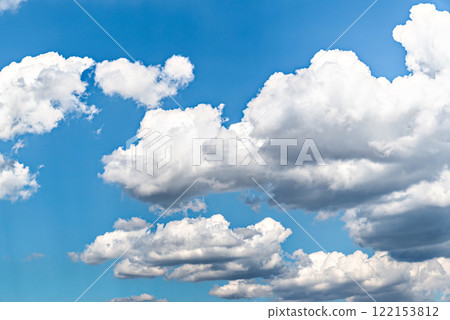 White clouds in a bright blue sky. The beauty of the nature White clouds in a bright blue sky. The beauty of the nature 122153812