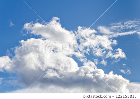 White clouds in a bright blue sky. The beauty of the nature 122153813
